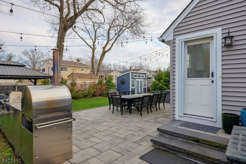 178 Tillotson Road Fanwood, NJ 07023 - Photo 28 of 38 a view of a patio with table and chairs and potted plants