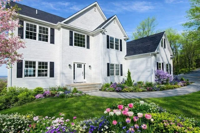 a front view of a house with a big yard
