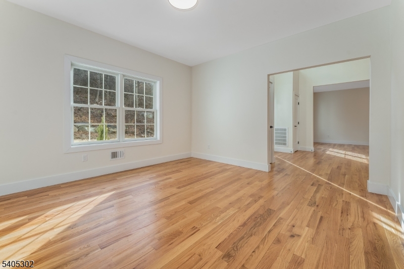 51 Staats Road Bloomsbury, NJ 08804 - Photo 14 of 45 a view of an empty room with wooden floor and a window