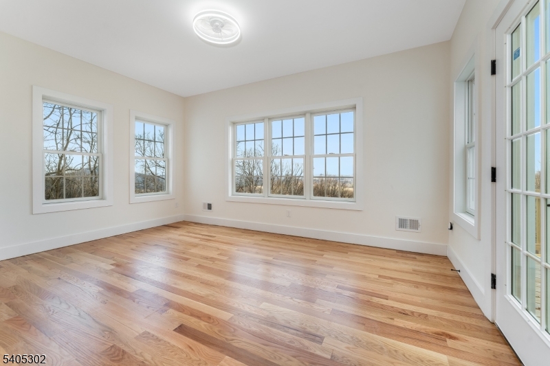 51 Staats Road Bloomsbury, NJ 08804 - Photo 15 of 45 a view of an empty room with wooden floor and a window