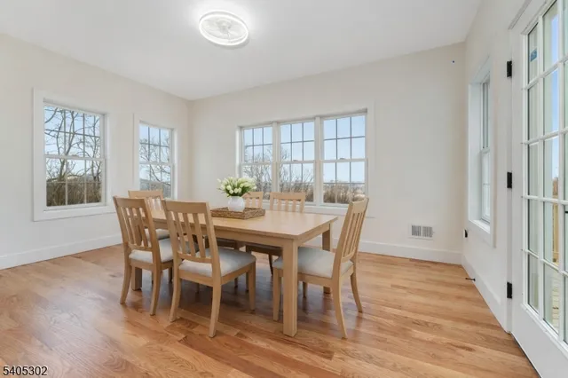 a living room with furniture a rug and a large window