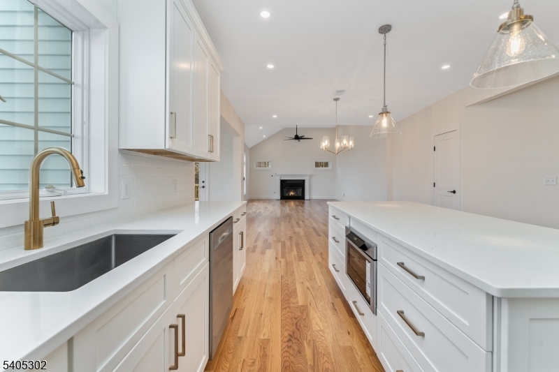 51 Staats Road Bloomsbury, NJ 08804 - Photo 33 of 45 a large kitchen with stainless steel appliances kitchen island a large island in the center
