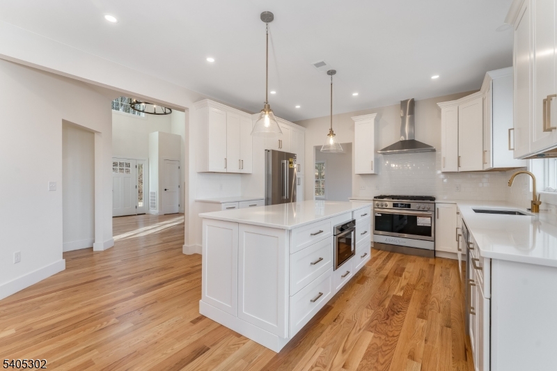 51 Staats Road Bloomsbury, NJ 08804 - Photo 10 of 45 a large kitchen with stainless steel appliances granite countertop a stove a sink a refrigerator and a wooden cabinets