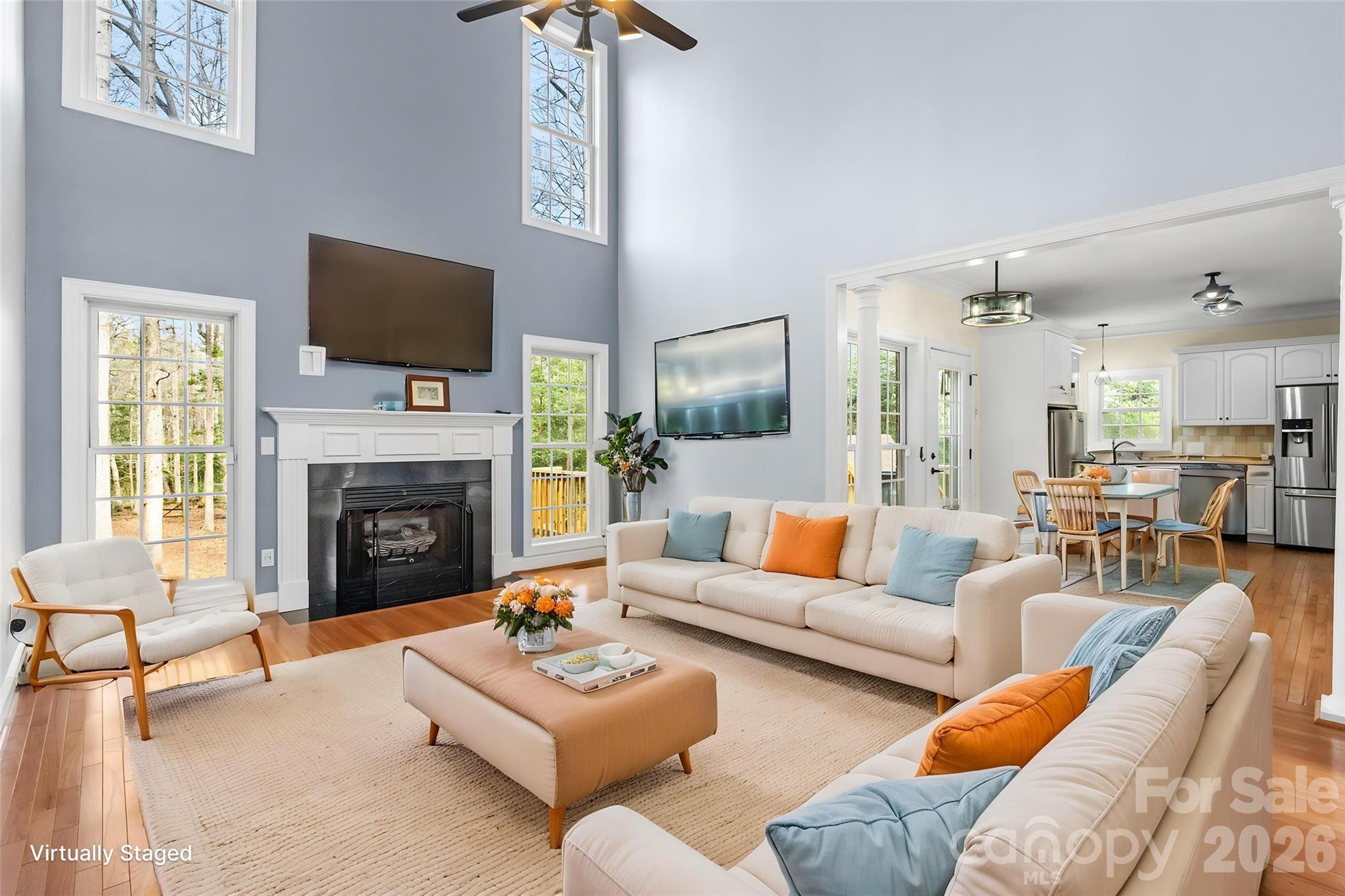 321 Forbes Court Clover, SC 29710 - Photo 5 of 31 a living room with furniture a fireplace and a flat screen tv