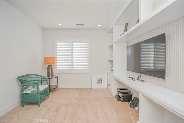 a spacious bathroom with a window and a sink