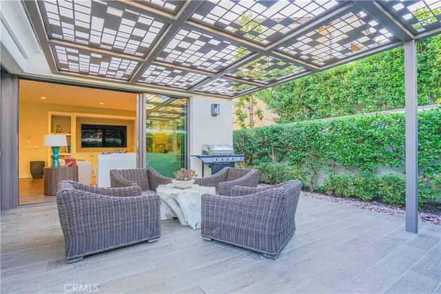 a living room with furniture and a garden