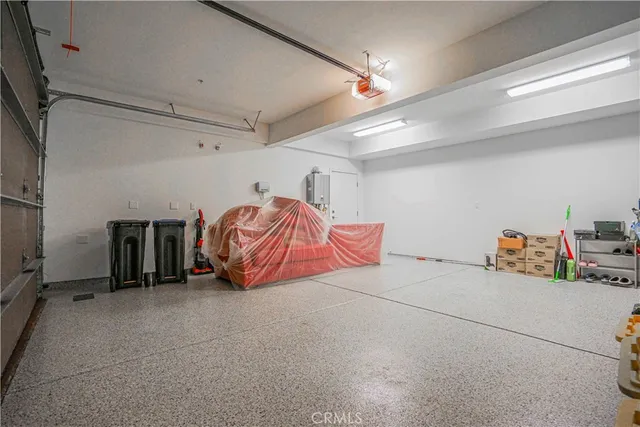 a view of storage and utility room with two washing machine