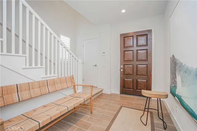 a view of an entryway with wooden floor