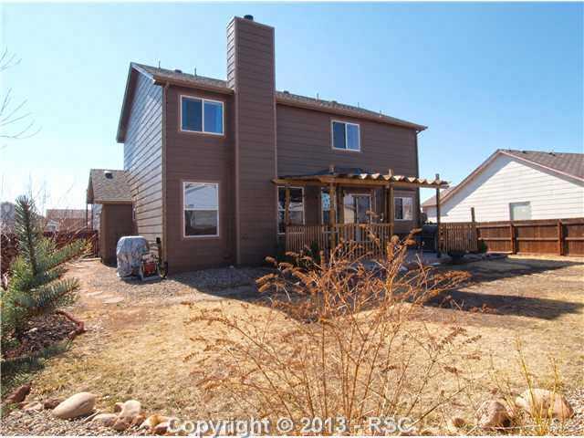 8072 Ferguson Road Peyton, CO 80831 - Photo 19 of 21 The lot is fully landscaped and features a garden area and producing fruit trees and bushes