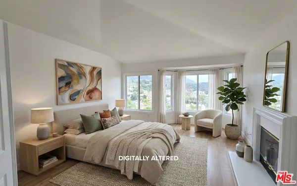 a view of living room with furniture and a fireplace