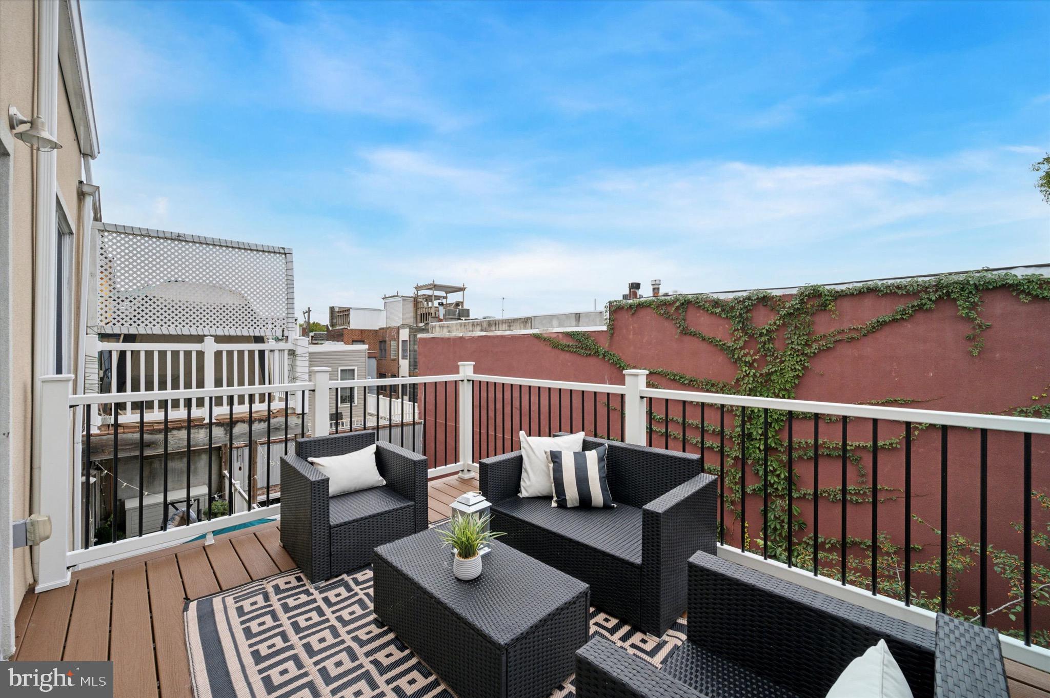 714 Bainbridge Street, Unit 9 Philadelphia, PA 19147 - Photo 20 of 25 a view of a balcony with wooden floor