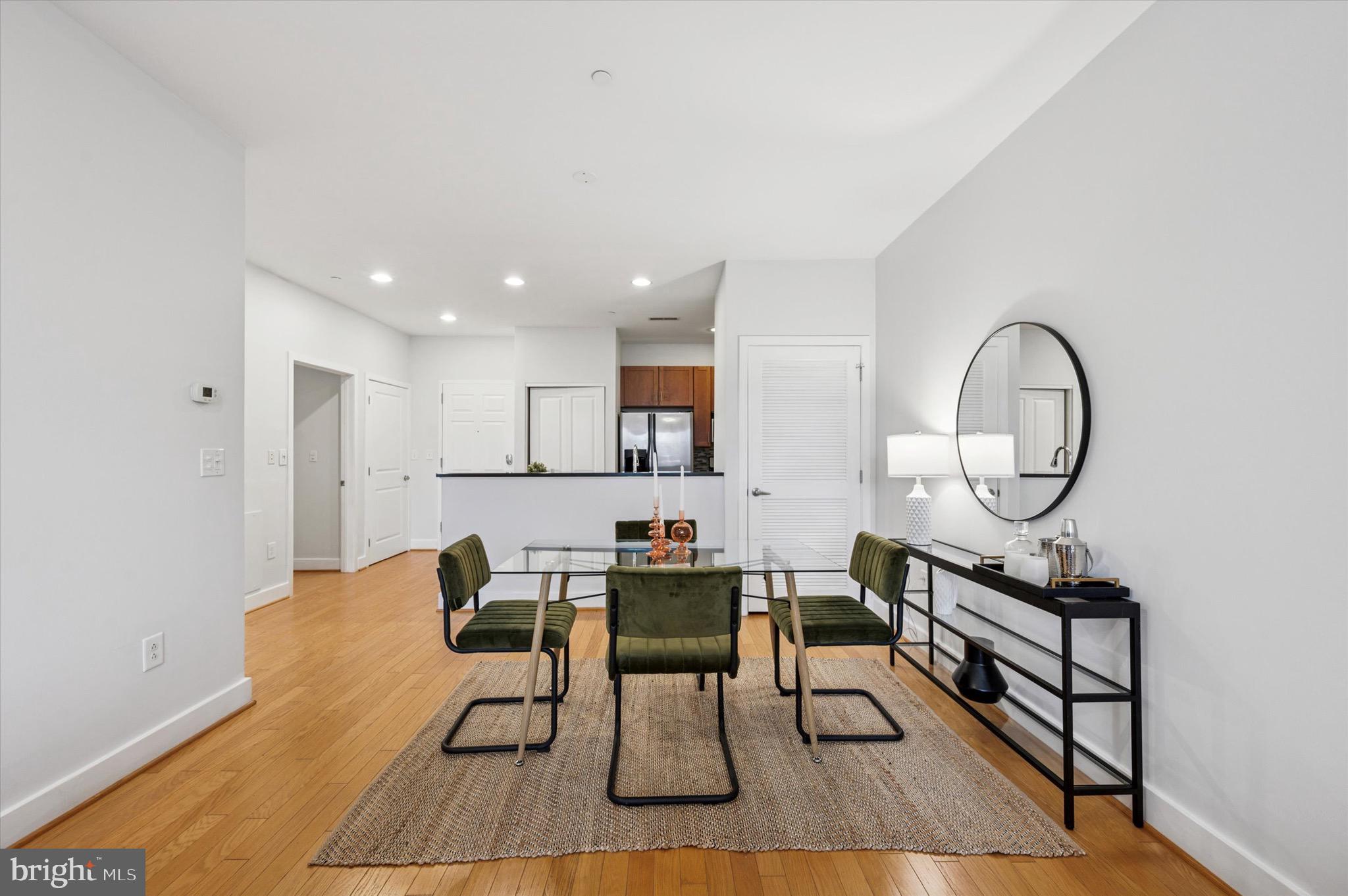 714 Bainbridge Street, Unit 9 Philadelphia, PA 19147 - Photo 7 of 25 a view of a dining room with furniture and wooden floor