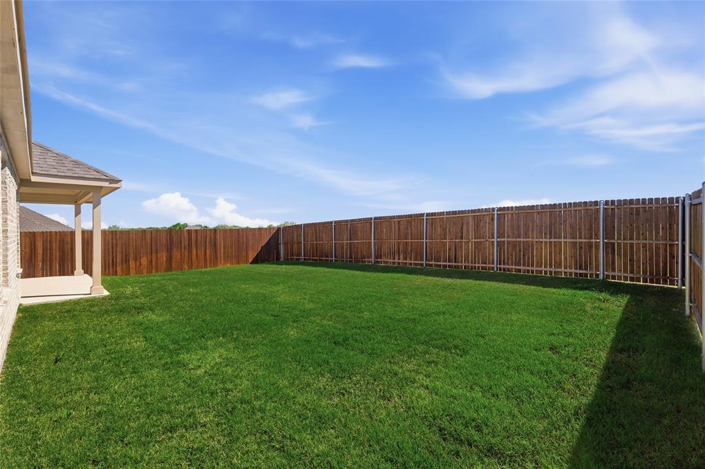2529 Rivers W Road Anna, TX 75409 - Photo 35 of 40 Expansive green lawn with a full privacy fence