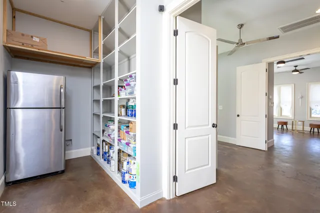 a bathroom with a granite countertop sink a large mirror and a shower