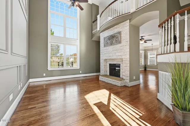 a bathroom with a granite countertop sink a mirror a vanity and a shower