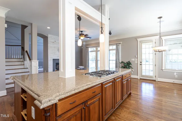 a front view of house with yard and trees around