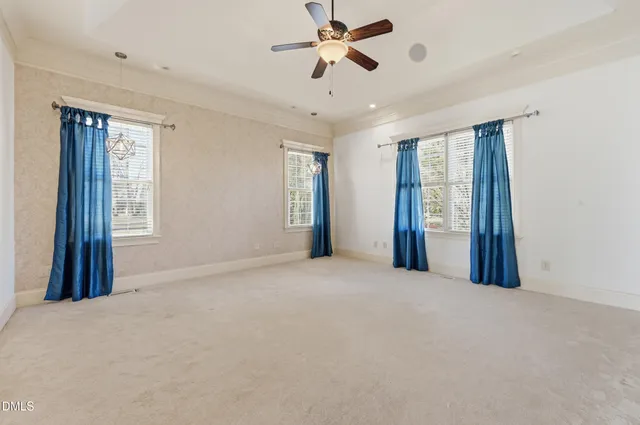 an aerial view of a house with outdoor space and lake view