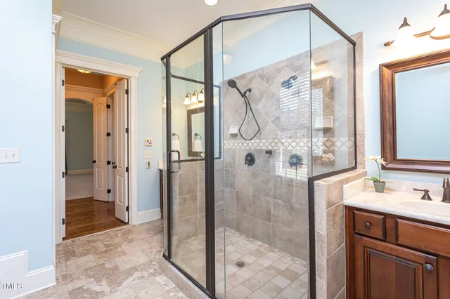 an aerial view of a house with outdoor space and a lake view