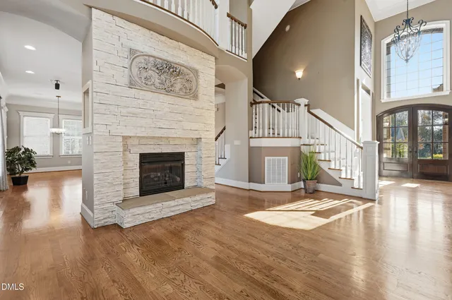 an outdoor sitting area with couch and wooden floor