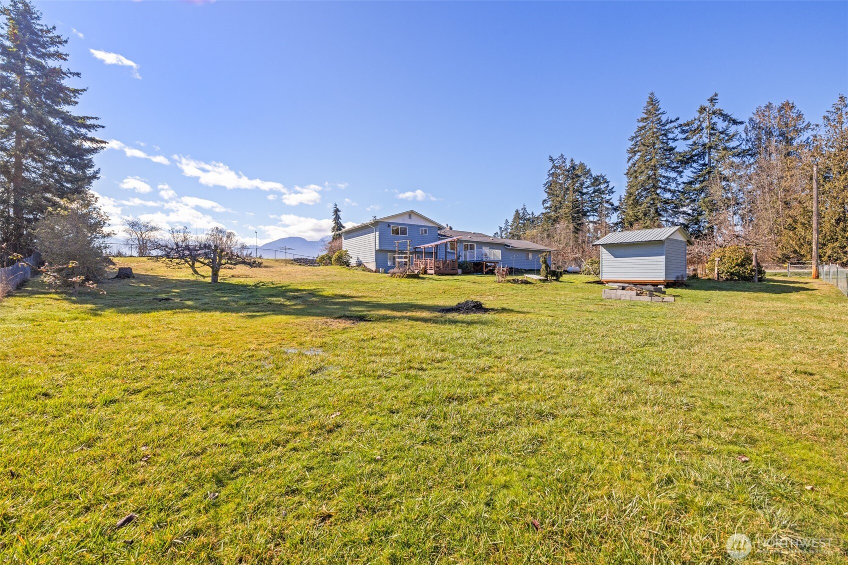 200 Lake Farm Road Port Angeles, WA 98362 - Photo 12 of 40 a view of a lake with a house in the background