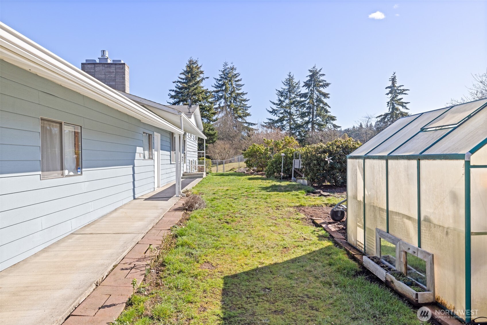 200 Lake Farm Road Port Angeles, WA 98362 - Photo 18 of 40 a view of a backyard with large trees