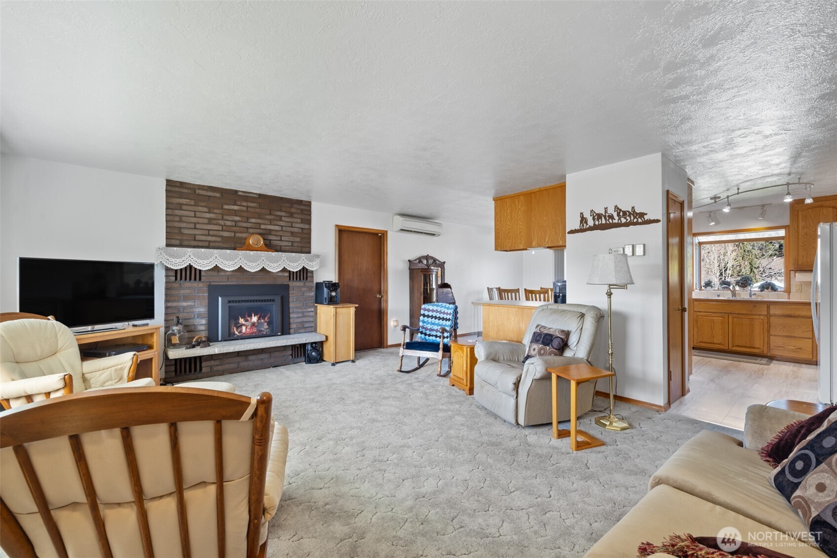 200 Lake Farm Road Port Angeles, WA 98362 - Photo 23 of 40 a bedroom with furniture and a fireplace