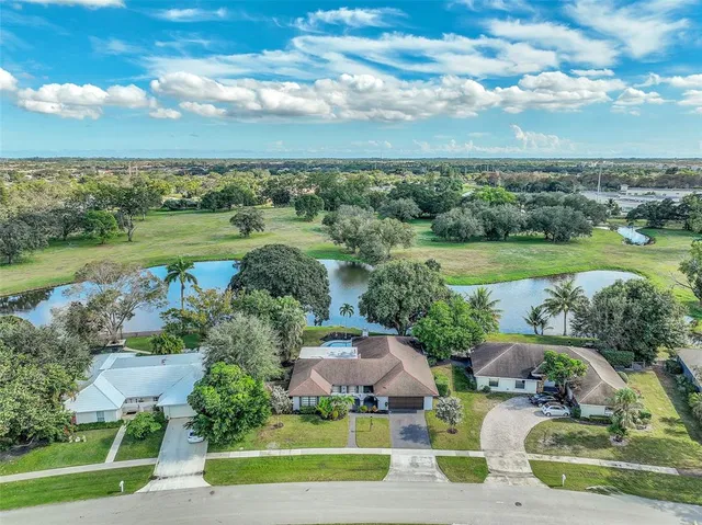 an aerial view of a houses with outdoor space and street view