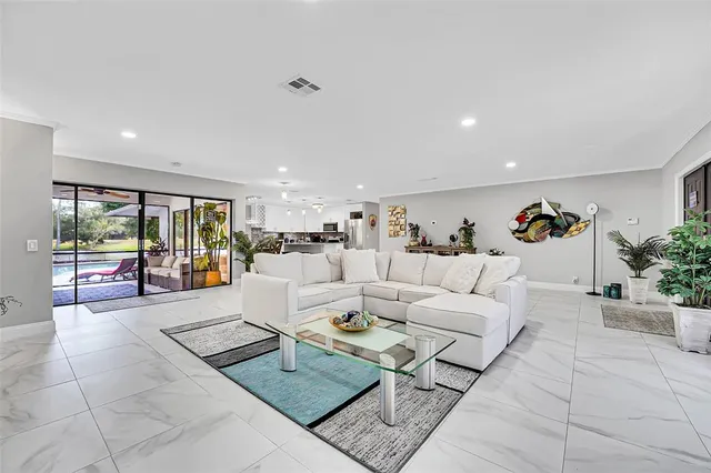 a living room with furniture and a table