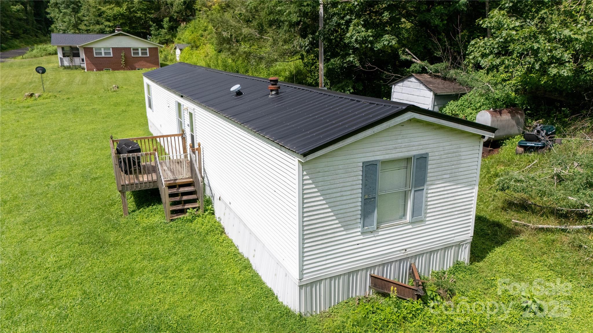 a aerial view of a house with a yard