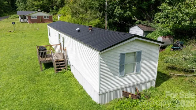 a aerial view of a house with a yard