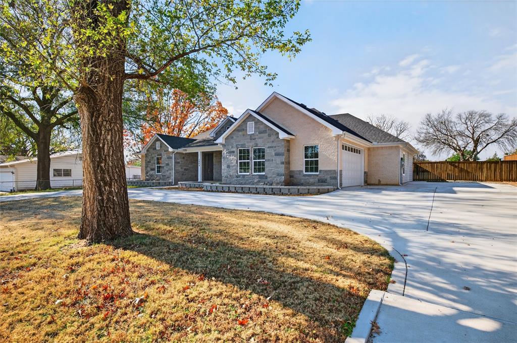 1809 Bluebonnet Avenue Denison, TX 75020 - Photo 4 of 40 a front view of a house with a patio