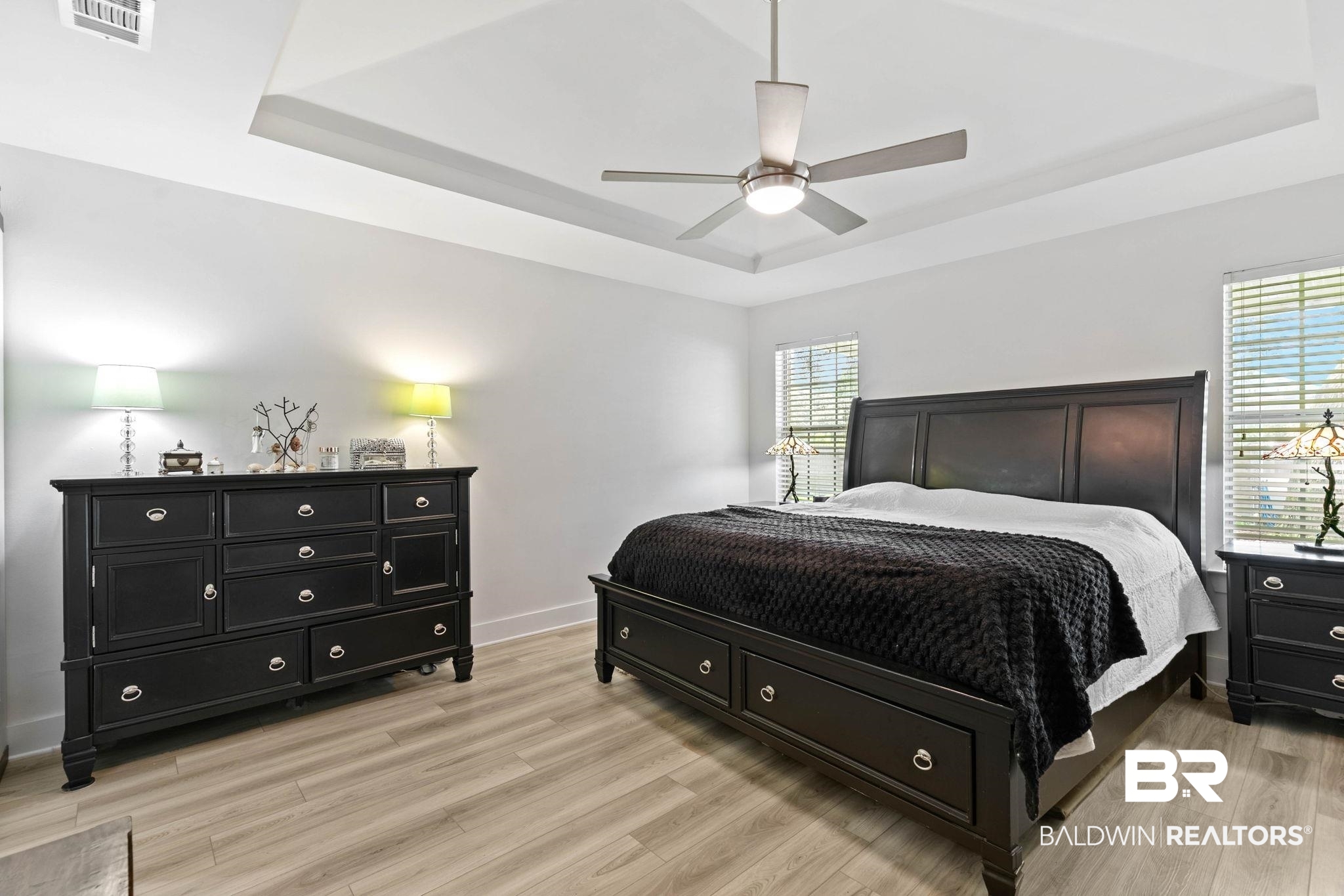 520 Juniper Place Drive Foley, AL 36535 - Photo 16 of 35 Light wood-finish flooring complements the white walls and tray ceiling