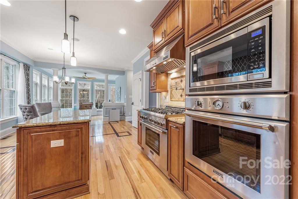 15501 Eagleview Drive Charlotte, NC 28278 - Photo 11 of 40 a kitchen with a stove oven and sink