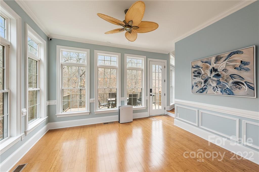 15501 Eagleview Drive Charlotte, NC 28278 - Photo 15 of 40 a view of an empty room with a window and wooden floor