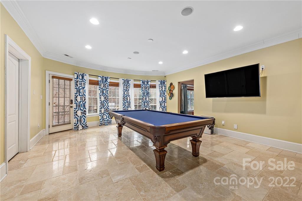 15501 Eagleview Drive Charlotte, NC 28278 - Photo 19 of 40 a living room with a flat screen tv and a floor to ceiling window
