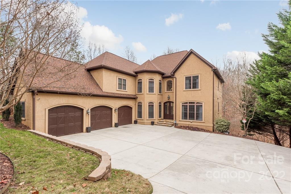 15501 Eagleview Drive Charlotte, NC 28278 - Photo 2 of 40 a front view of a house with a yard and garage