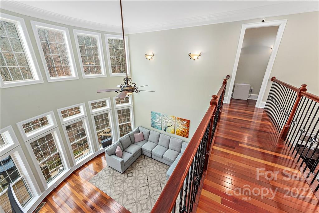 15501 Eagleview Drive Charlotte, NC 28278 - Photo 23 of 40 a living room with furniture fireplace and wooden floor