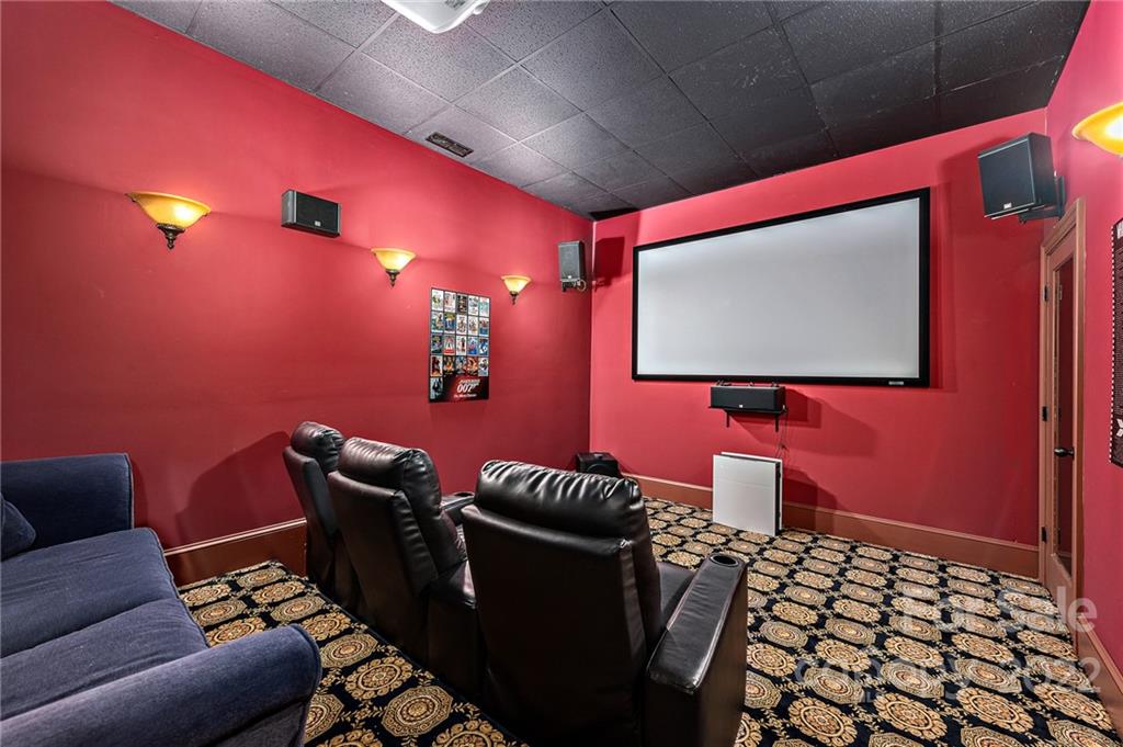15501 Eagleview Drive Charlotte, NC 28278 - Photo 26 of 40 a projector room with a couch
