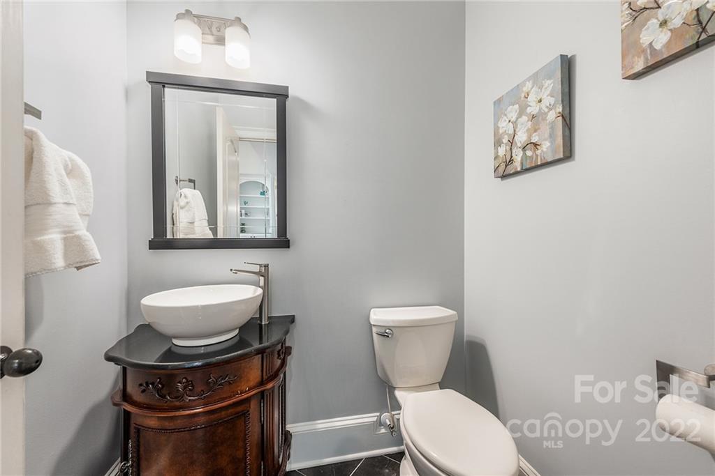 15501 Eagleview Drive Charlotte, NC 28278 - Photo 7 of 40 a white toilet sitting next to a bathroom sink