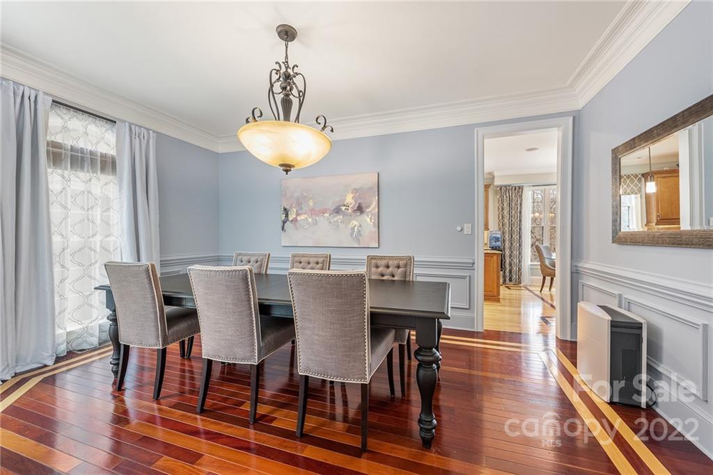 15501 Eagleview Drive Charlotte, NC 28278 - Photo 8 of 40 a view of a dining room with furniture wooden floor and chandelier