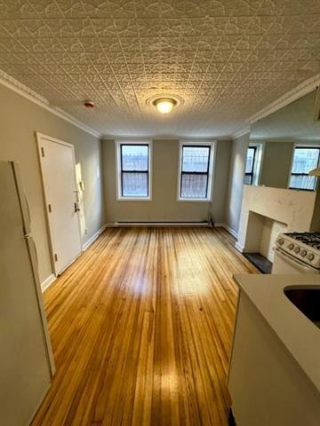 504 Court Street, Unit 1 Hoboken, NJ 07030 - Photo 1 of 12 wooden floor in an empty room with a window