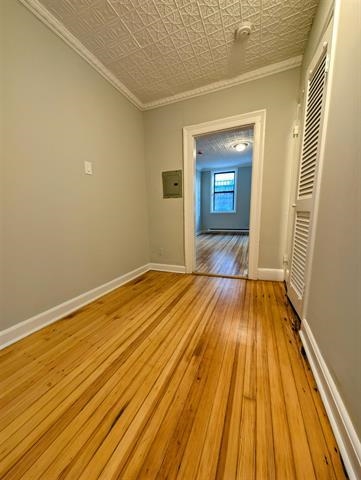 504 Court Street, Unit 1 Hoboken, NJ 07030 - Photo 6 of 12 a view of a room with wooden floor and staircase