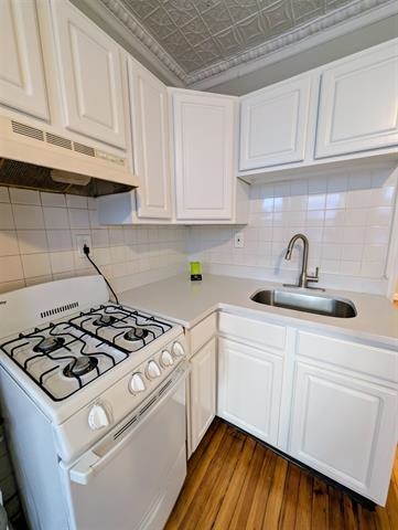 504 Court Street, Unit 1 Hoboken, NJ 07030 - Photo 8 of 12 a kitchen with white cabinets and appliances