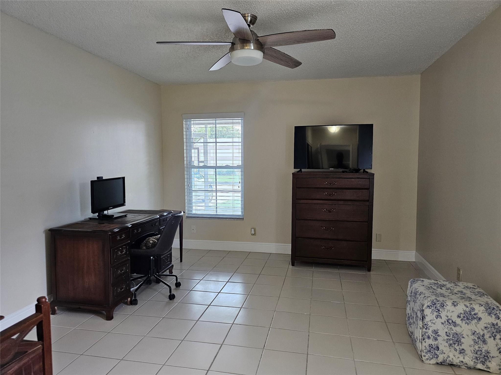 9245 Flynn Circle, Unit 8 Boca Raton, FL 33496 - Photo 21 of 36 a view of workspace with furniture and windows