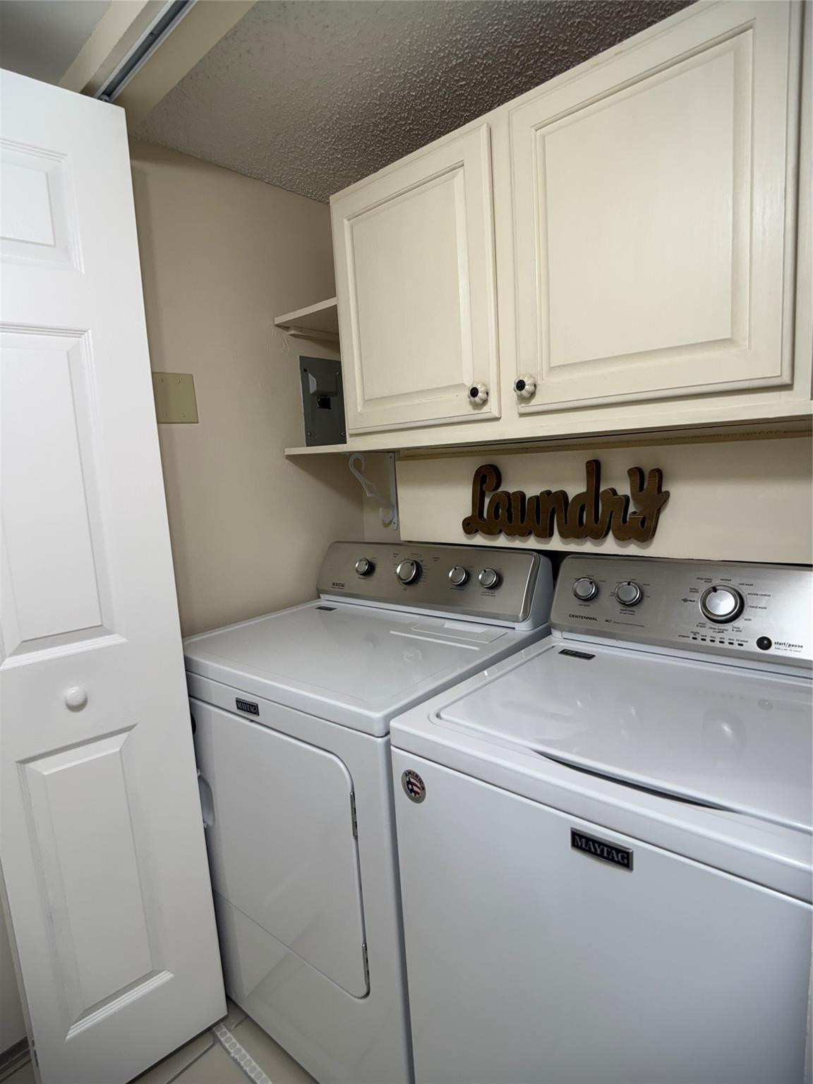 9245 Flynn Circle, Unit 8 Boca Raton, FL 33496 - Photo 27 of 36 a utility room with dryer and washer