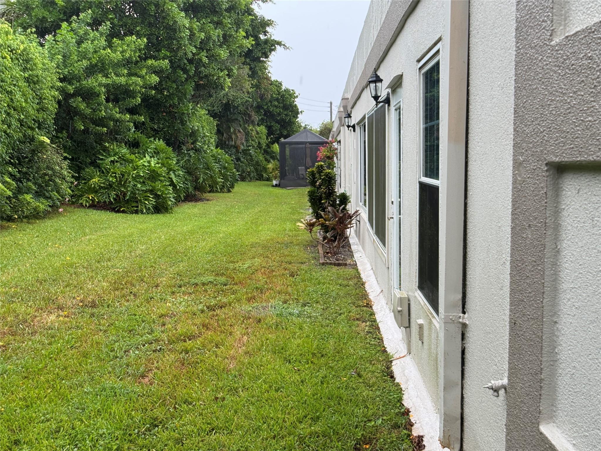 9245 Flynn Circle, Unit 8 Boca Raton, FL 33496 - Photo 31 of 36 a view of a yard from balcony