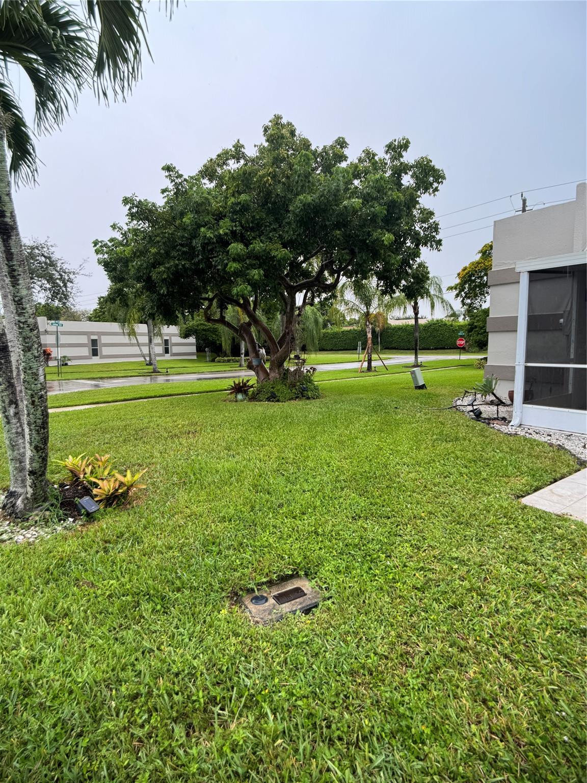 9245 Flynn Circle, Unit 8 Boca Raton, FL 33496 - Photo 32 of 36 a garden view with a sitting space