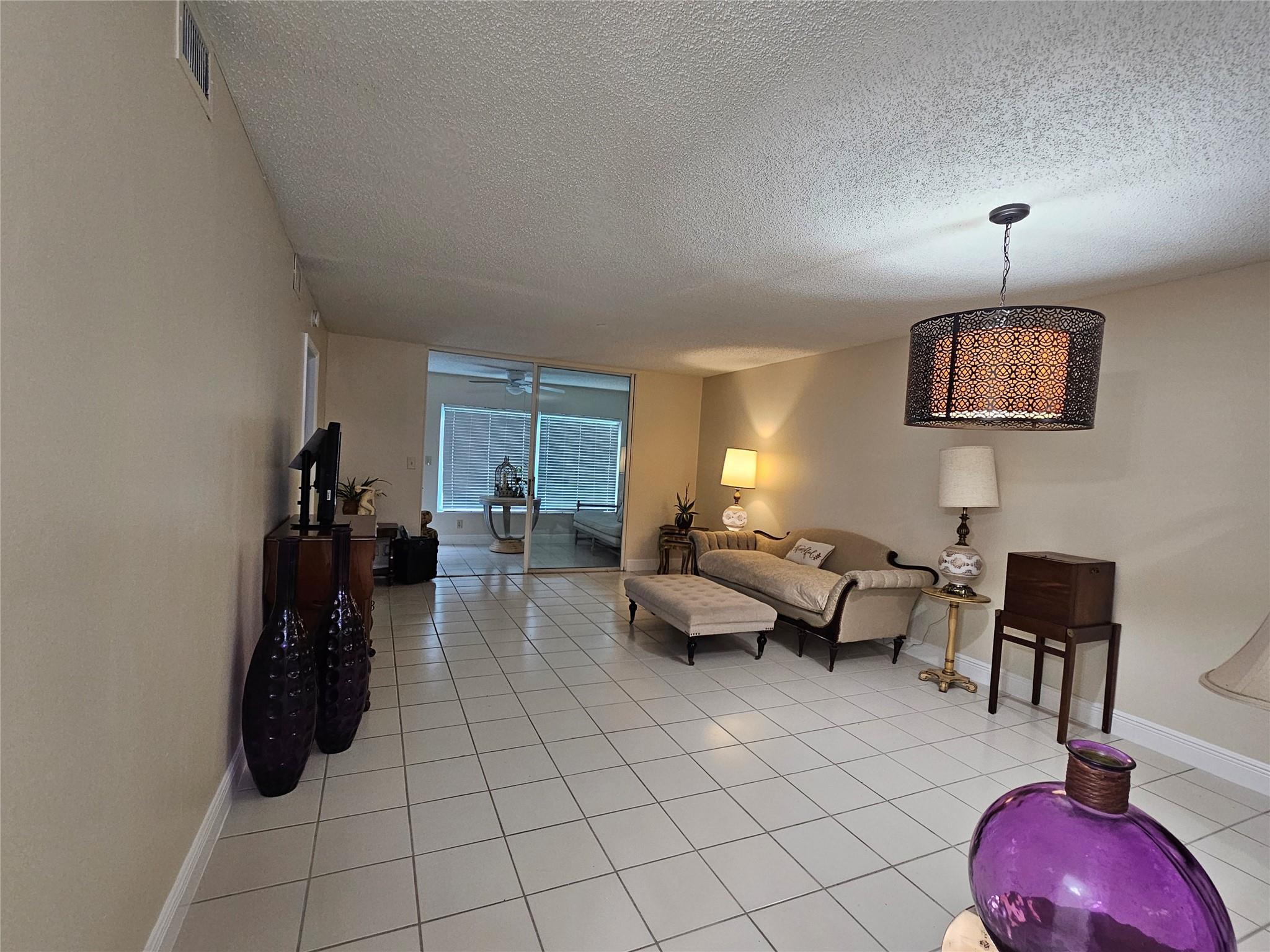 9245 Flynn Circle, Unit 8 Boca Raton, FL 33496 - Photo 8 of 36 a living room with furniture