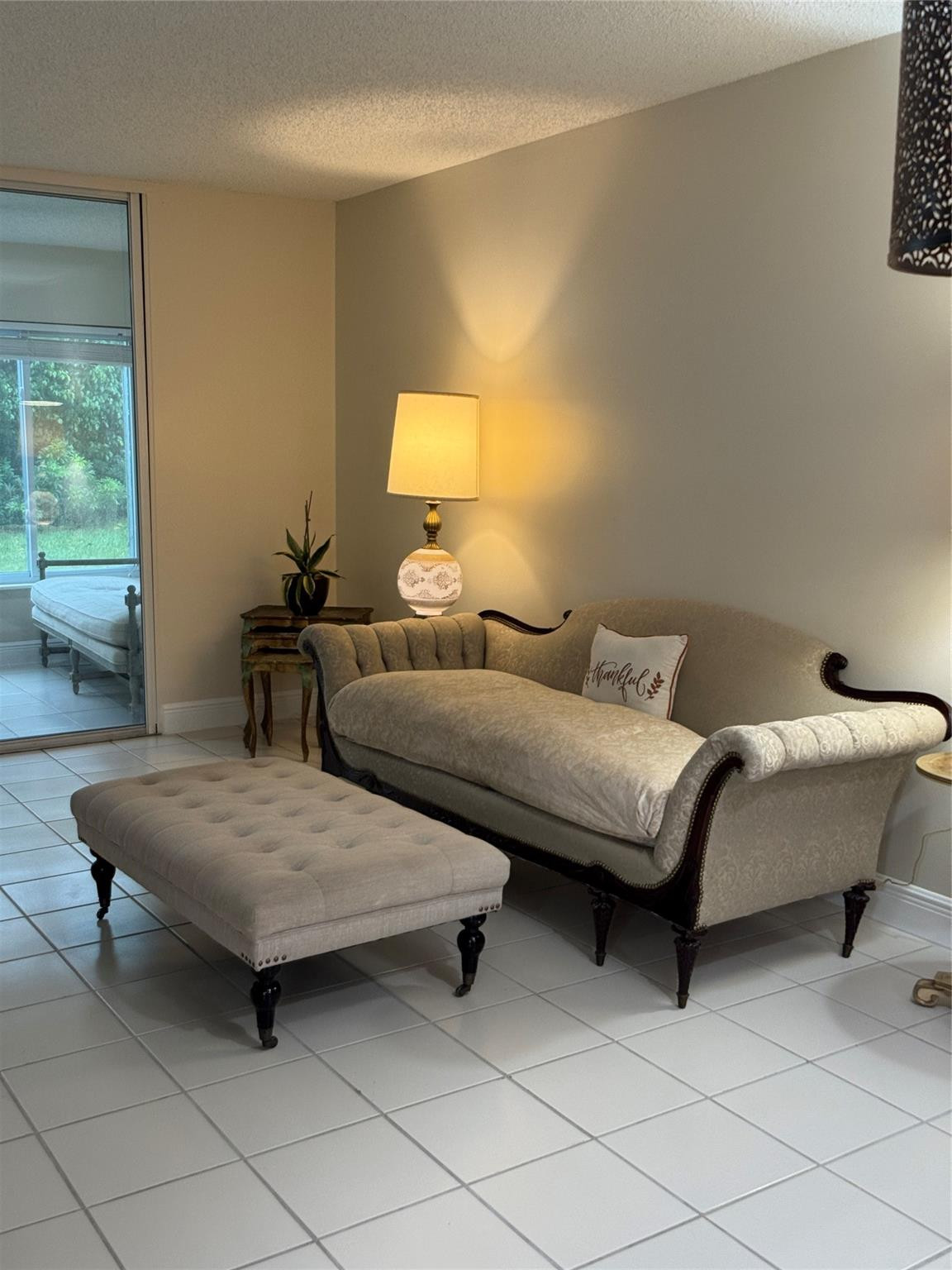 9245 Flynn Circle, Unit 8 Boca Raton, FL 33496 - Photo 9 of 36 a bedroom with furniture and a lamp