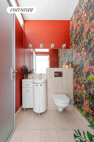 a view of a hallway with potted plants